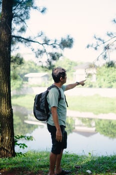 Man Taking a Selfie While Traveling to a Cool Lakeside, so far photo