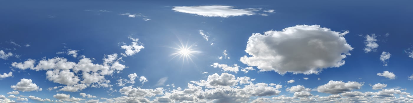 Clouds and sun in blue sky photo
