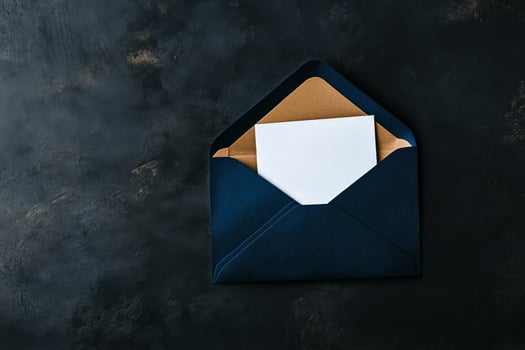 Elegant Navy Envelope With Blank Card on a Black Surface. photo