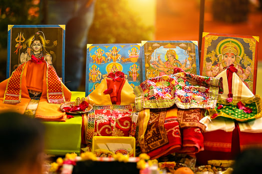 Colorful Religious Altar Featuring Hindu Deities and Vibrant Decorations photo