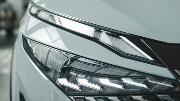 Close-up of car headlights. An advanced design concept that improves visibility, demonstrates innovation and adds style to night driving. photo