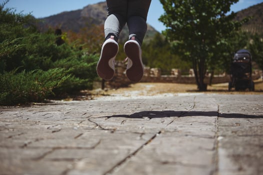 Dynamic Action Shot of a Person Jumping Outdoors Against Nature photo