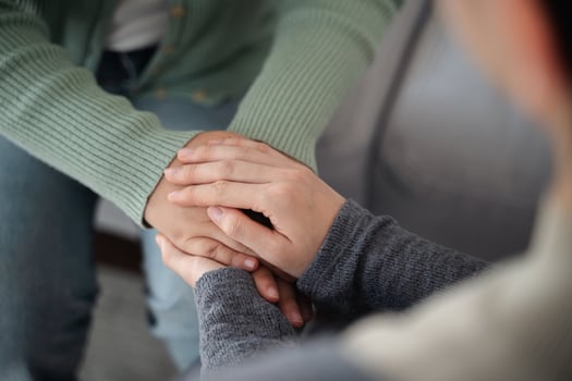 Psychologist, friend, family holding hands to encourage patient with depression, anxiety, therapy photo