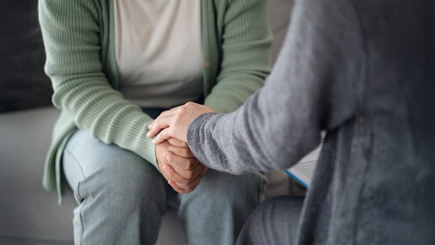 Psychologist or family holding hands to encourage patient with depression, anxiety, therapy photo