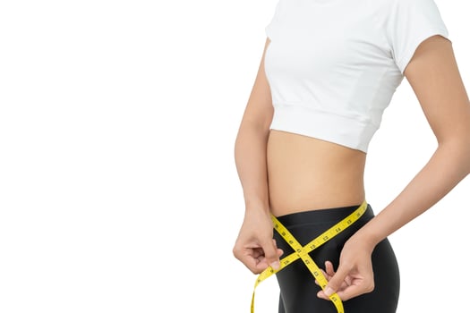 Diet and dieting, Beauty slim female body use tape measure. Woman in exercise clothes achieves weight loss goal for healthy life, crazy about thinness, thin waist, nutritionist. photo