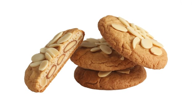 A stack of almond cookies with a cut cookie showing the almond texture on white background photo