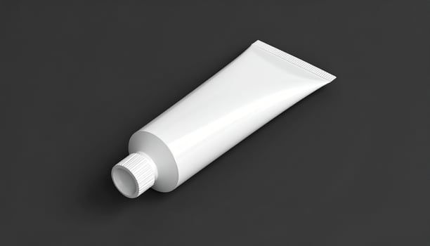 White Oil Paint Tube On Matte Black Background photo