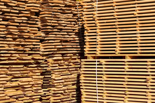 Storage of piles of wooden boards photo