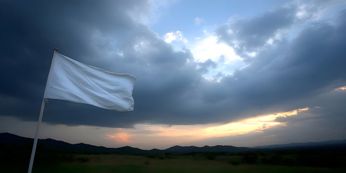 White Flag Waving in Sunset Landscape Dramatic Sky Mountains Field photo