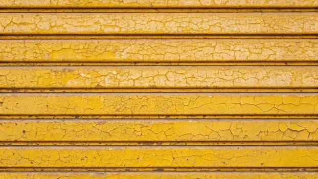 Yellow painted metal wall stripe texture abstract background and texture. photo