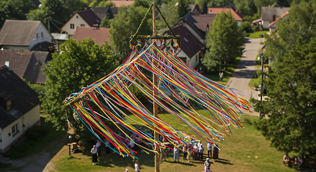 Maypole Tradition Celebration with Ribbons in Village Green Landscape photo