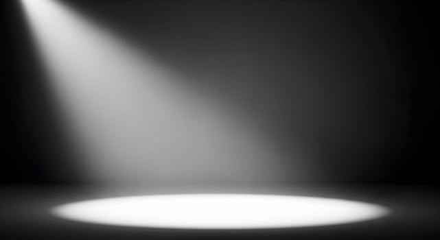 Grayscale Spotlight Scene with Dramatic Lighting and Dark Minimalist Background photo