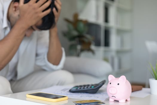 Stressed and headache man with large bills or invoices no money to pay to expenses and credit card debt. shortage, Financial problem, bankruptcy, mortgage, loan, bankrupt, poor photo