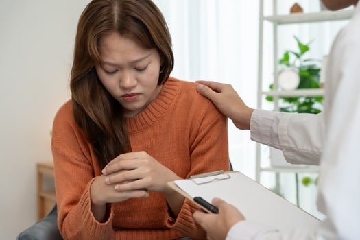 woman with mental health problems is consulting. psychiatrist is recording the patient's condition for treatment. encouragement, love and family problem, bipolar , depression patient, protect suicide, photo