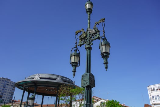 A tall green light post photo