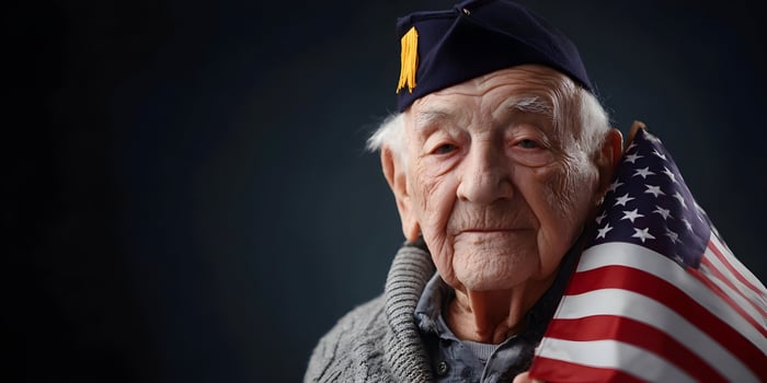 Portrait of Senior American War Veteran Holding Flag photo