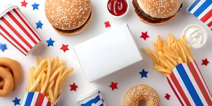 Patriotic Themed Fast Food Meal Two Burgers French Fries Onion Rings Drinks photo