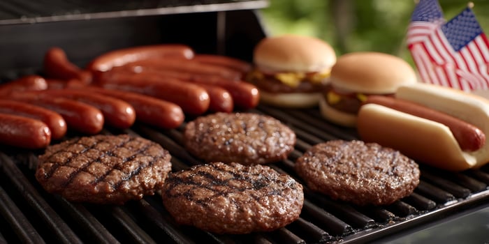 Grilled Hot Dogs Hamburgers and Beef Patties on BBQ Grill Fathers Day Picnic photo