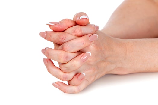 Beautiful female hands with french manicure isolated on a white background photo