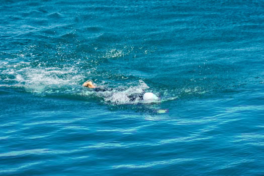 Triathlon Training Swimmer Perfecting their Stroke in the Sea photo