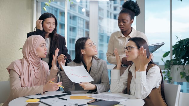 Diverse professionals discussing in office setting photo