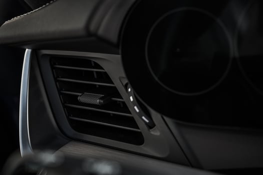 Interior View of a Modern Car Dashboard Highlighting Air Vent Design and Control photo