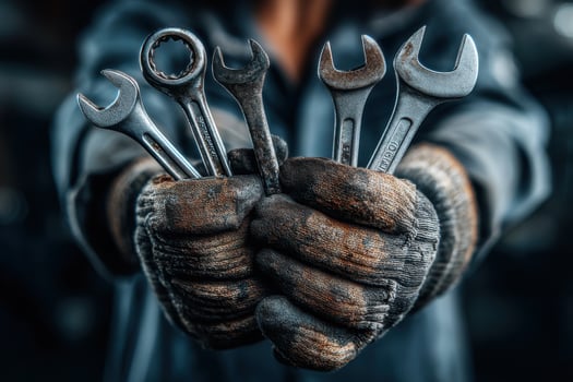 A person holding a wrench in their hands photo