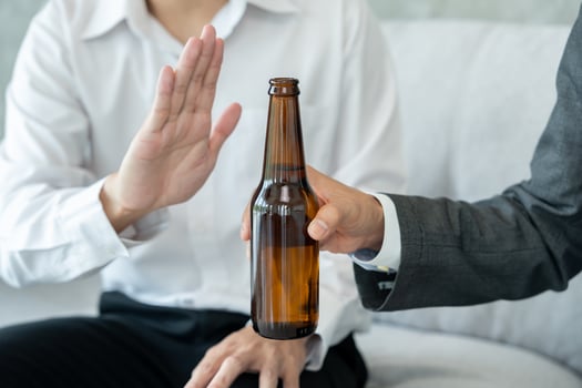 refuses say no and avoid to drink an alcohol, hand show reject and stopping, alcoholism treatment, alcohol addiction, quit booze, Stop Drinking Alcohol. Refuse bottle liquor. photo