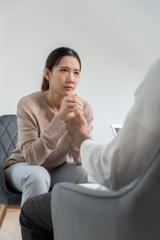 woman with mental health problems is consulting. psychiatrist is recording the patient's condition for treatment. encouragement, family problem, bipolar photo
