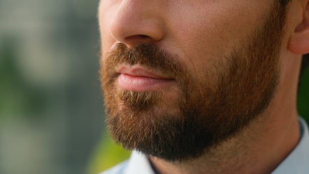 Close up cropped view Caucasian half face mouth lips calm serious unrecognizable European bristle bearded man bristle bearded skin medicine businessman guy male business in city collar formal shirt photo