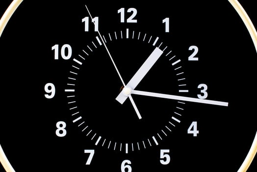 Clocks tell the time of work and life, processes and rules of limited time. Photo of clock in studio.