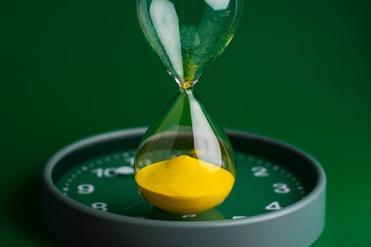 Hourglass stops time of work and life. Process and rules of limited photo