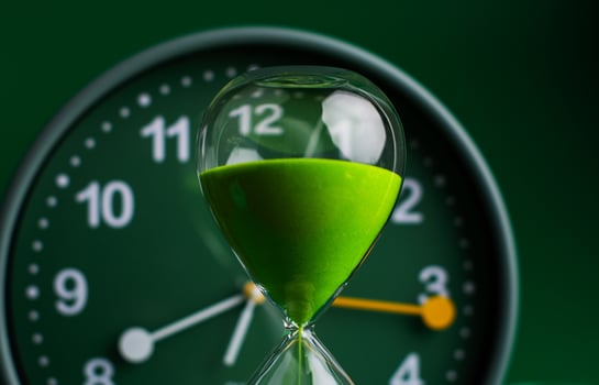Hourglass stops time of work and life. Process and rules of limited time. Hourglass photo