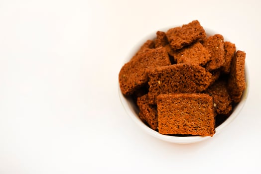 Spicy and salty crackers in cups. Food and snacks.Bread snacks. photo