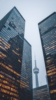 Urban Skyline With Modern Glass Buildings and Tower During Overcast Evening. photo