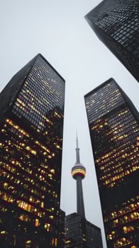 City Skyline View With Illuminated Buildings and CN Tower in Toronto During Evening Twilight photo