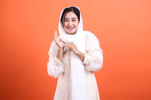 Warm Invitation, Charming woman in traditional dress with a chee photo