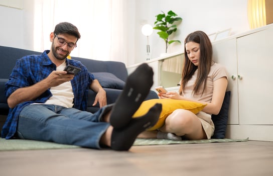 Young couple are smiling while relax and working online via laptop in living room at home,53 photo