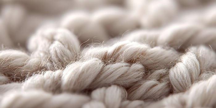Closeup Beige Knit Texture Soft Wool Yarn Fabric Background photo