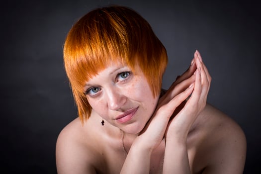 moscow, russia, 14.06.2017 A woman with red hair and a short haircut is posing for a picture photo