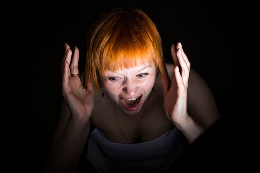 moscow, russia, 14.06.2017 A woman with red hair is crying and her face is red photo
