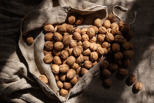Whole walnuts in a burlap bag photo