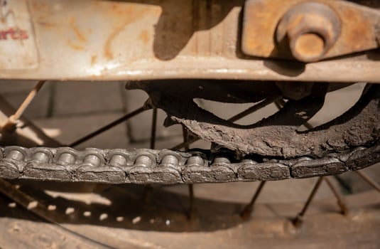 The old motorbike chain was not maintained so there was a lot of dry oil stuck to it photo