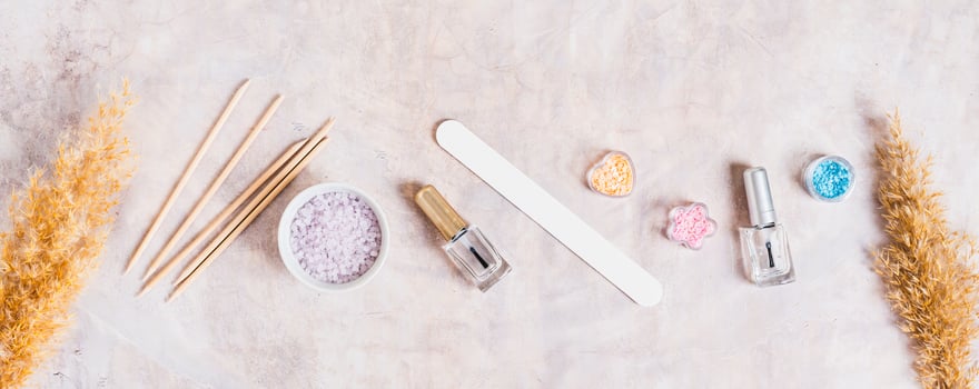 Set of items for manicure and pedicure on the table top view web banner photo
