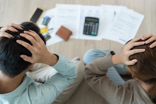 Stressed headache asian couple with large bills or invoices no money to pay to expenses and credit card debt. shortage, Financial problems, mortgage, loan, bankruptcy, bankrupt, poor, empty wallet photo