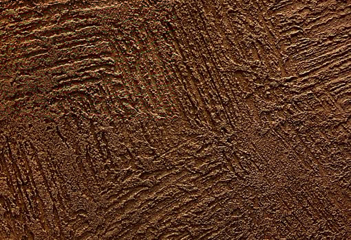 black decorative and textured plaster. Construction and finishing materials for repairs of walls in apartments, houses and offices. Background and texture for design and decoration. photo