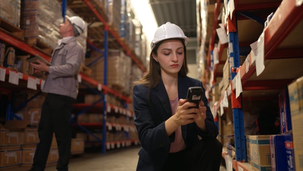 Business woman and warehouse workers are reviewing the list of items based on the documentation,81 photo