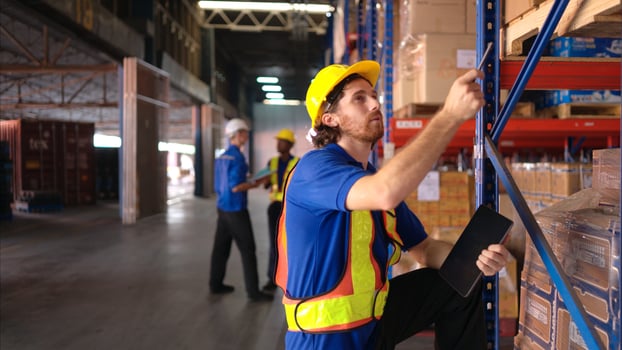 Portrait of warehouse workers are reviewing the list of items based on the documentation,65 photo