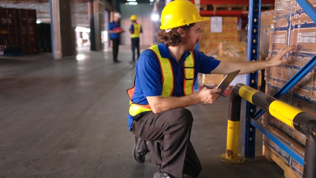 Portrait of warehouse workers are reviewing the list of items based on the documentation,21 photo