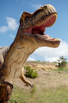 Huge Artificial dinosaur tyrannosaurus, close-up of dinosaur photo